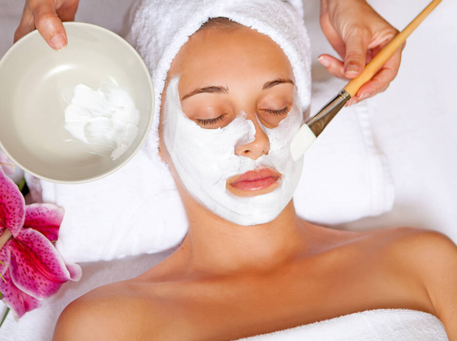 woman at spa having relaxing face mask
